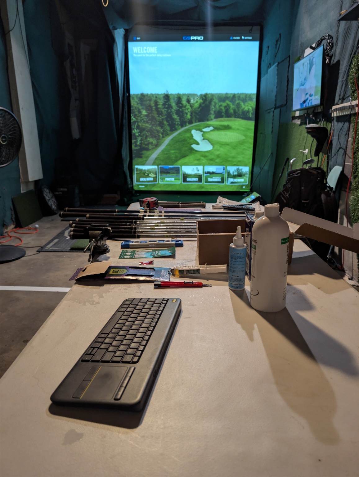 Donny's golf simulator bay and club workbench in Lakewood